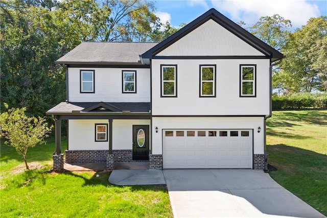 view of front of property featuring a front lawn and a garage