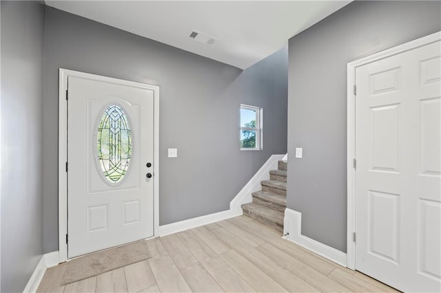 foyer with light hardwood / wood-style floors