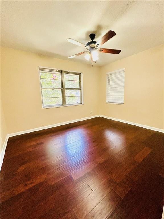 unfurnished room featuring ceiling fan and hardwood / wood-style flooring