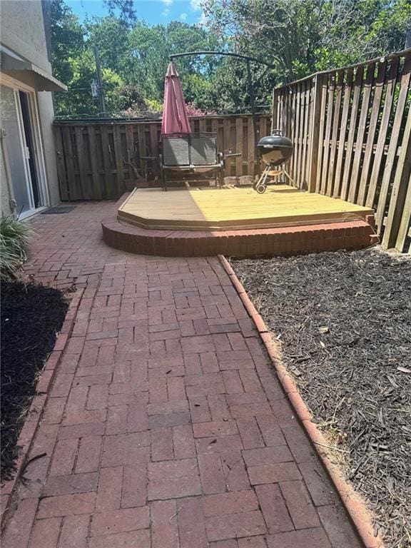 view of patio with a wooden deck