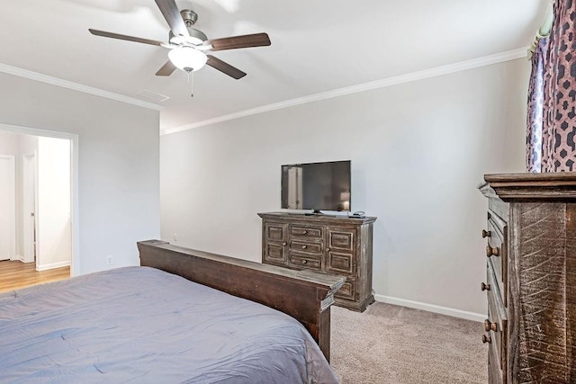 bedroom featuring crown molding, baseboards, ceiling fan, and visible vents