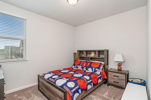 carpeted bedroom with baseboards
