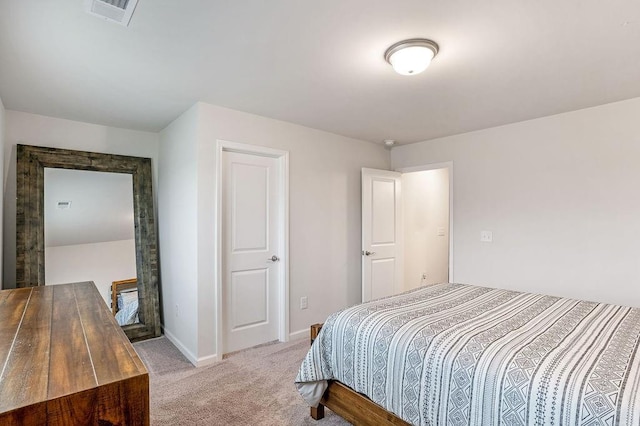 bedroom featuring visible vents, baseboards, and light carpet