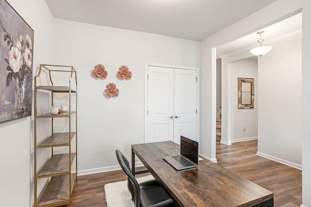 office space featuring baseboards and dark wood finished floors