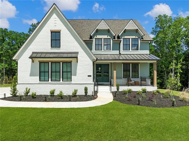 view of front of home with a front lawn and a porch