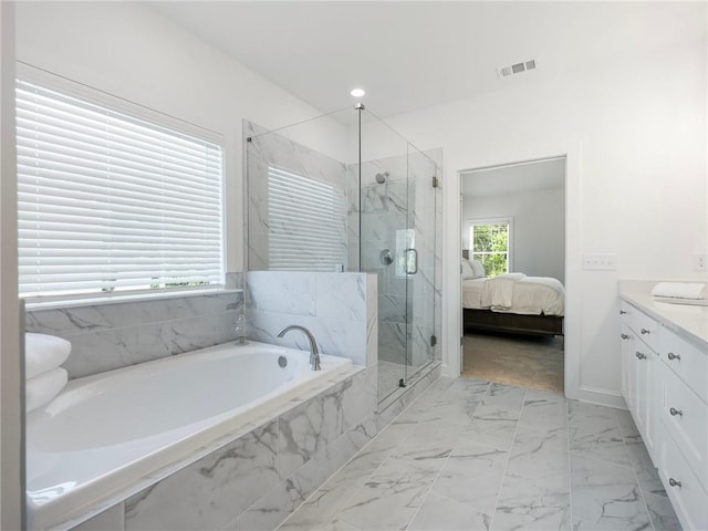 bathroom featuring vanity and plus walk in shower