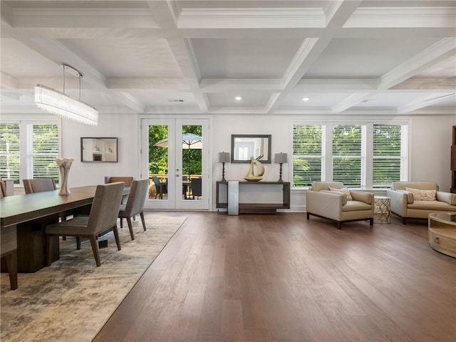 interior space with french doors, coffered ceiling, beam ceiling, crown molding, and dark hardwood / wood-style flooring