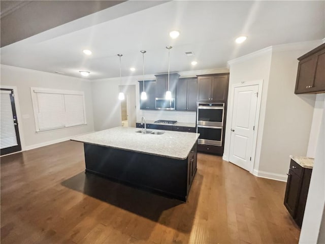 3650 Lindsy Brooke Ct, Douglasville, GA 30135 - kitchen with stainless steel appliances, a sink, crown molding, baseboards, and wood finished floors