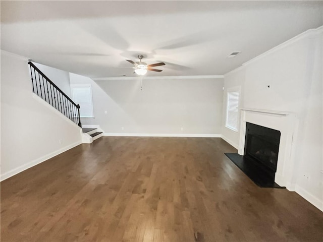 3650 Lindsy Brooke Ct, Douglasville, GA 30135 - unfurnished living room featuring ceiling fan, a fireplace, ornamental molding, stairs, and wood finished floors