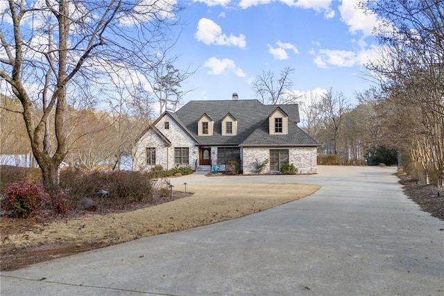 4777 Destitute Way, Gainesville, GA 30506 - view of front facade featuring stone siding, a chimney, and curved driveway