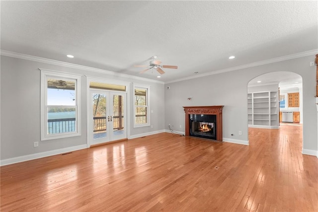 4777 Destitute Way, Gainesville, GA 30506 - unfurnished living room with ceiling fan, light wood-style floors, healthy amount of natural light, french doors, and a textured ceiling