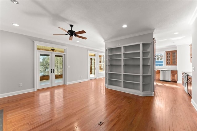 4777 Destitute Way, Gainesville, GA 30506 - unfurnished living room featuring ceiling fan, light wood finished floors, plenty of natural light, recessed lighting, and french doors