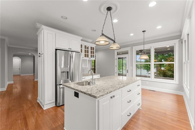 4777 Destitute Way, Gainesville, GA 30506 - kitchen featuring stainless steel fridge, a sink, arched walkways, white cabinetry, and recessed lighting