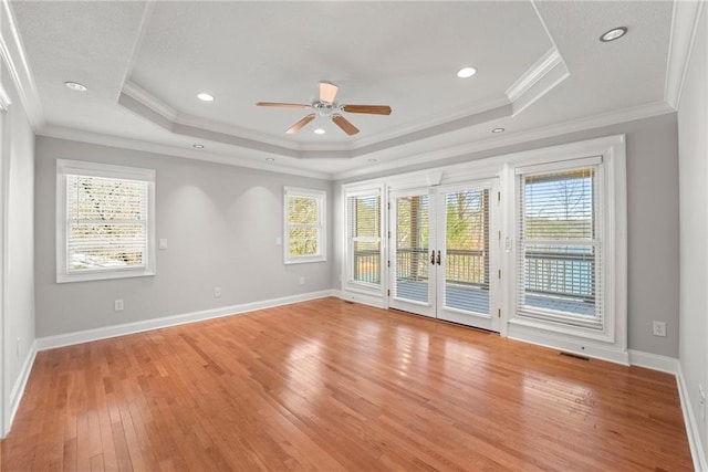4777 Destitute Way, Gainesville, GA 30506 - spare room featuring ceiling fan, light wood-style floors, a tray ceiling, french doors, and baseboards