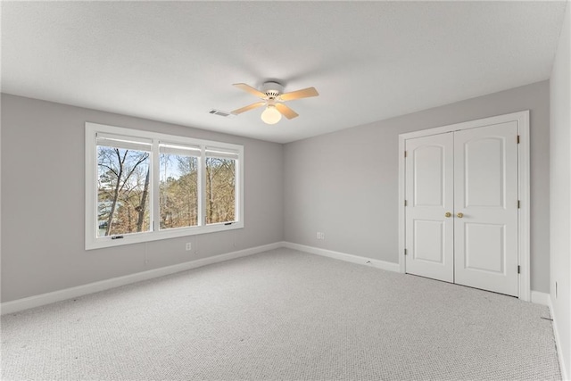 4777 Destitute Way, Gainesville, GA 30506 - unfurnished bedroom featuring baseboards, carpet floors, a closet, and ceiling fan