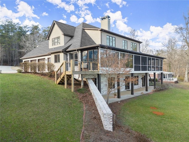 4777 Destitute Way, Gainesville, GA 30506 - rear view of property featuring a sunroom, a chimney, a lawn, and a wooden deck