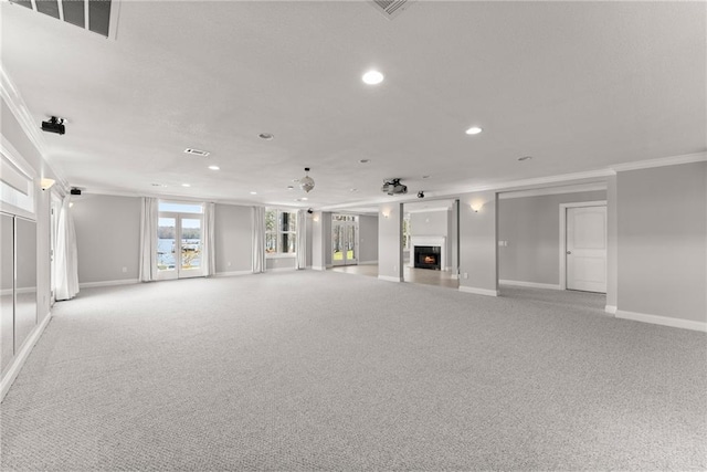 4777 Destitute Way, Gainesville, GA 30506 - unfurnished living room with ornamental molding, recessed lighting, light colored carpet, baseboards, and a warm lit fireplace
