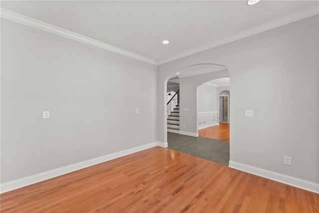 4777 Destitute Way, Gainesville, GA 30506 - spare room featuring arched walkways, wood finished floors, recessed lighting, baseboards, and stairs