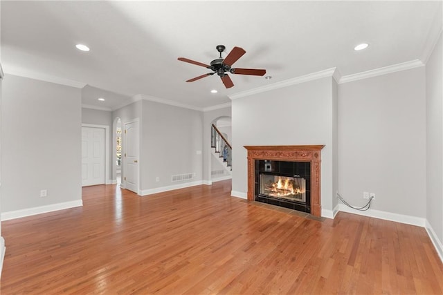 4777 Destitute Way, Gainesville, GA 30506 - unfurnished living room with recessed lighting, arched walkways, light wood-type flooring, a ceiling fan, and a fireplace
