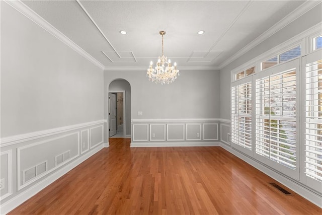 4777 Destitute Way, Gainesville, GA 30506 - unfurnished dining area with arched walkways, plenty of natural light, a chandelier, wood finished floors, and wainscoting