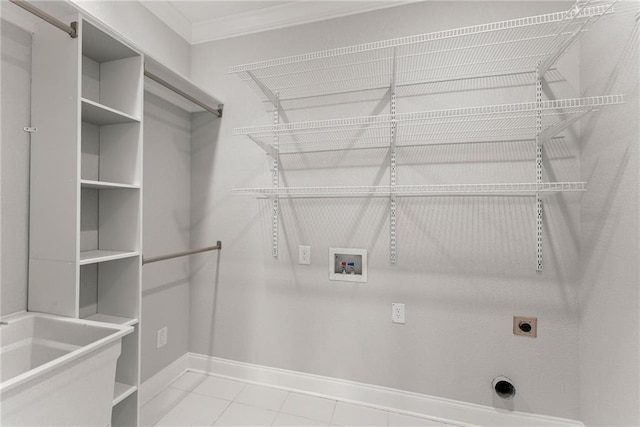 4777 Destitute Way, Gainesville, GA 30506 - washroom featuring hookup for an electric dryer, hookup for a washing machine, crown molding, baseboards, and tile patterned floors