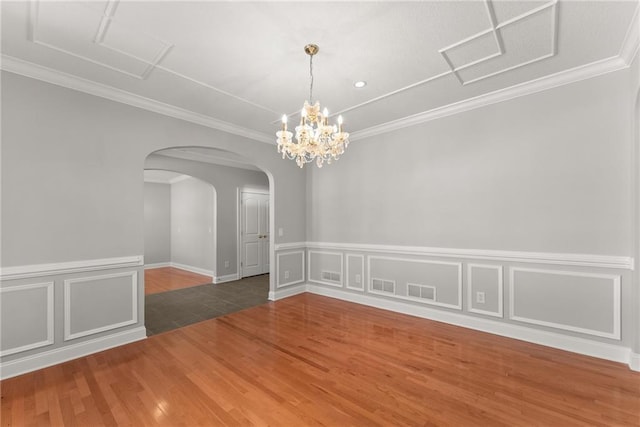 4777 Destitute Way, Gainesville, GA 30506 - spare room featuring attic access, wood finished floors, wainscoting, a decorative wall, and arched walkways
