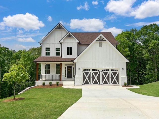 modern farmhouse style home with board and batten siding, concrete driveway, a porch, and a front lawn