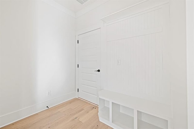mudroom featuring baseboards and light wood-style flooring