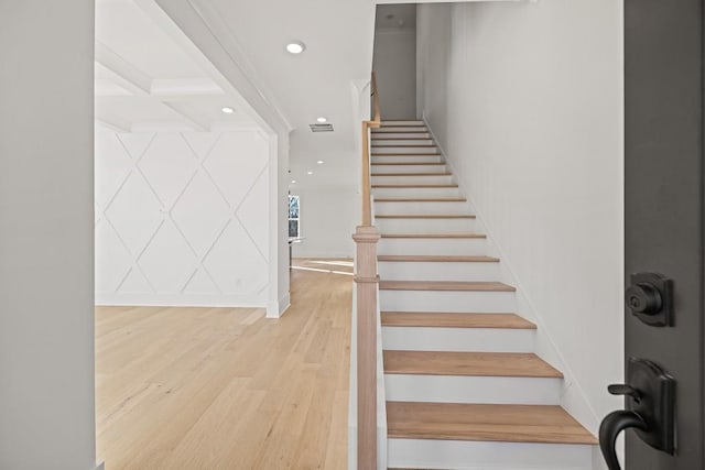 staircase with hardwood / wood-style flooring