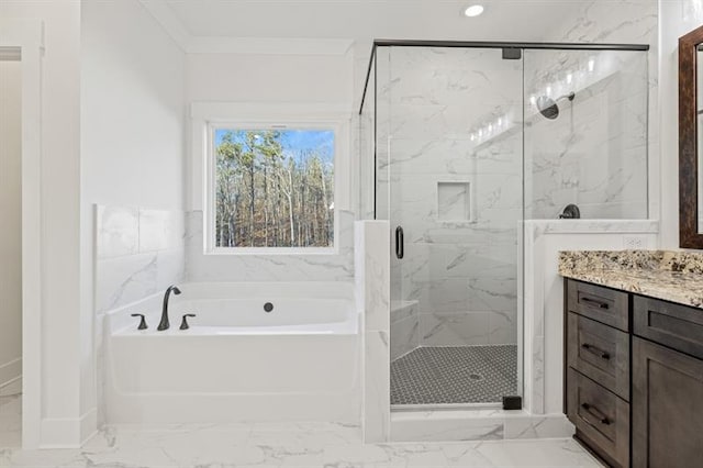 bathroom featuring vanity, marble finish floor, a bath, and a shower stall