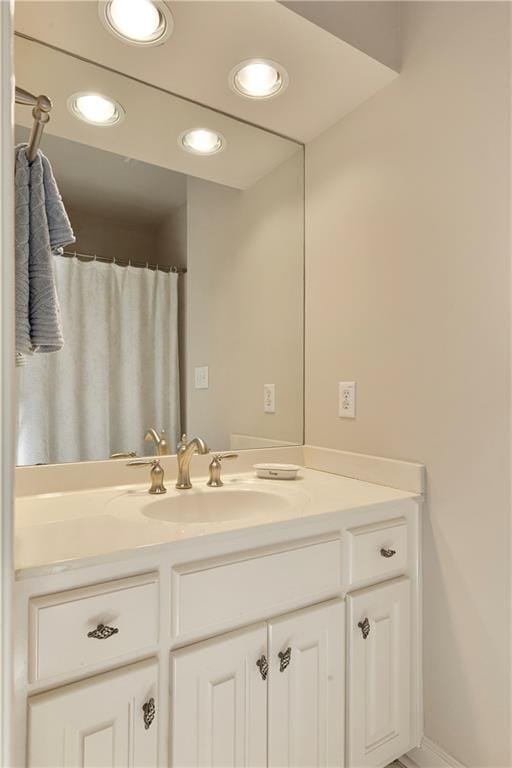 full bath with recessed lighting and vanity