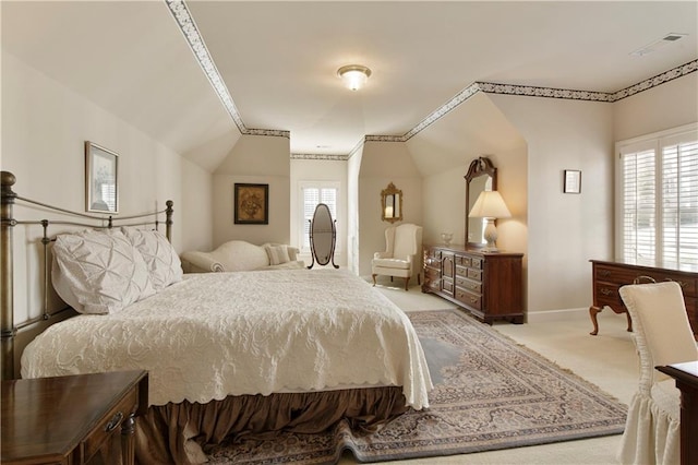 bedroom featuring light carpet, multiple windows, visible vents, and baseboards