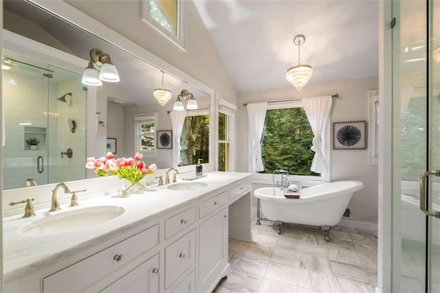 bathroom featuring a shower stall, vaulted ceiling, a soaking tub, and double vanity