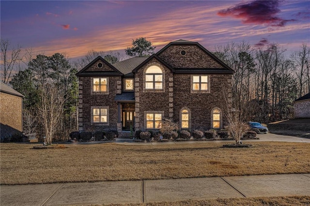 view of front of property with a lawn