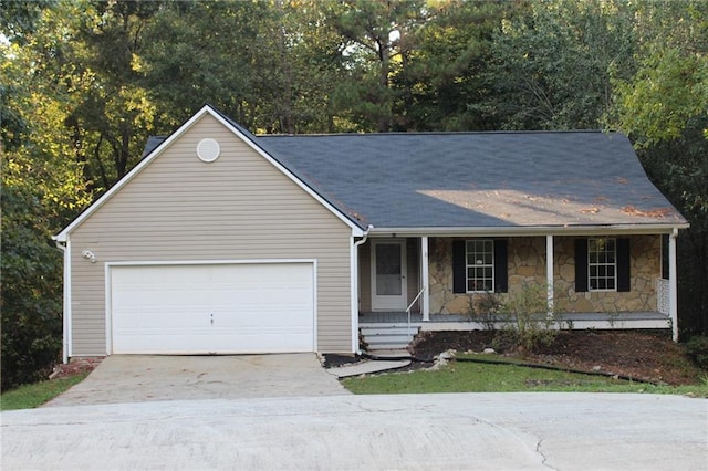 ranch-style home with a garage and covered porch