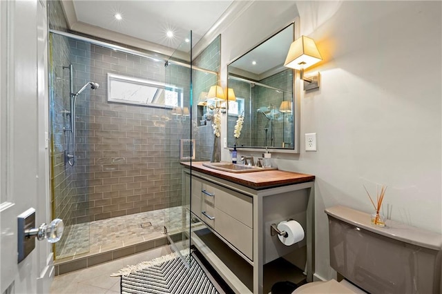 bathroom featuring vanity, recessed lighting, a stall shower, tile patterned floors, and toilet