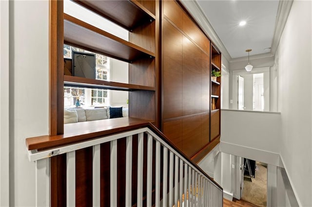 stairway featuring recessed lighting, baseboards, and crown molding