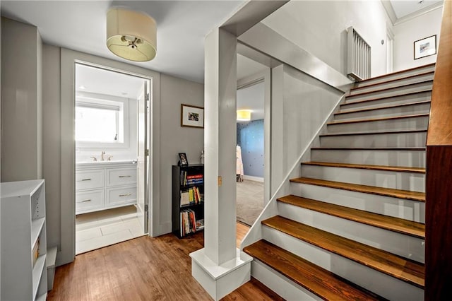 staircase with wood finished floors