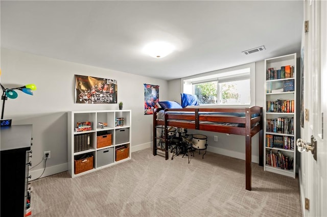 bedroom with baseboards, visible vents, and carpet floors