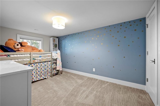 unfurnished bedroom with baseboards, light colored carpet, and wallpapered walls