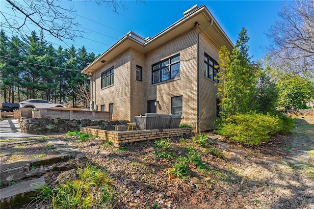 rear view of house with brick siding