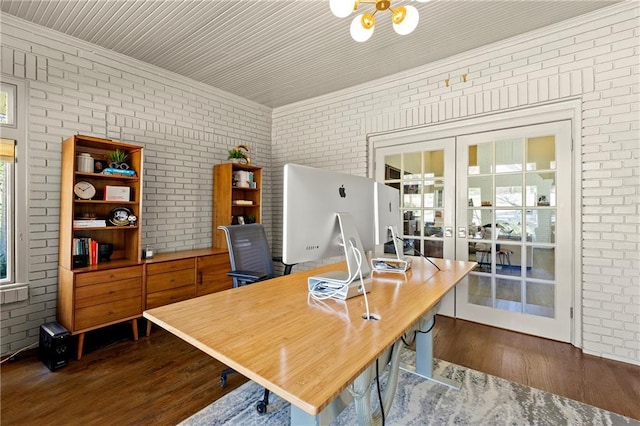 office with french doors, brick wall, and dark wood-style flooring