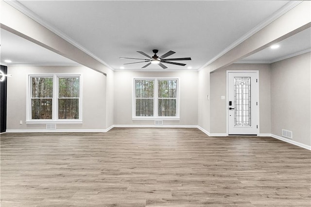 foyer with light wood-type flooring, ceiling fan, and ornamental molding