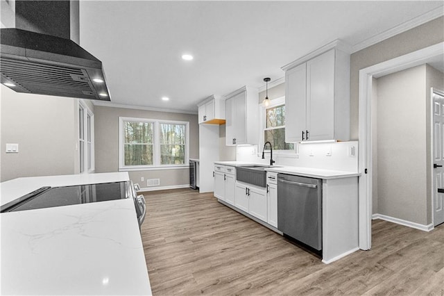 kitchen with decorative light fixtures, white cabinets, dishwasher, and range hood