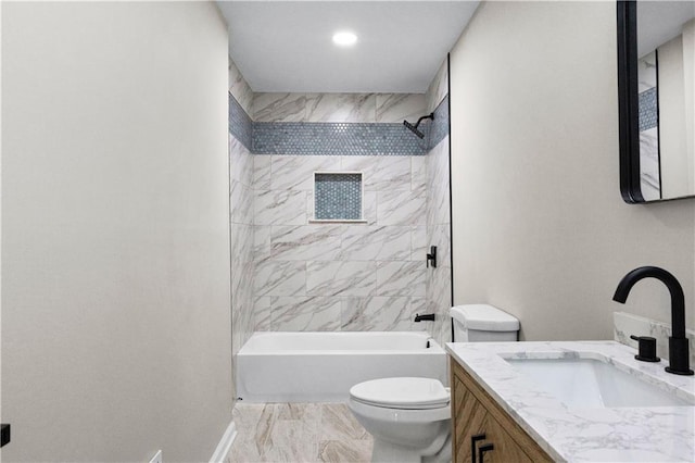 full bathroom with toilet, vanity, and tiled shower / bath combo