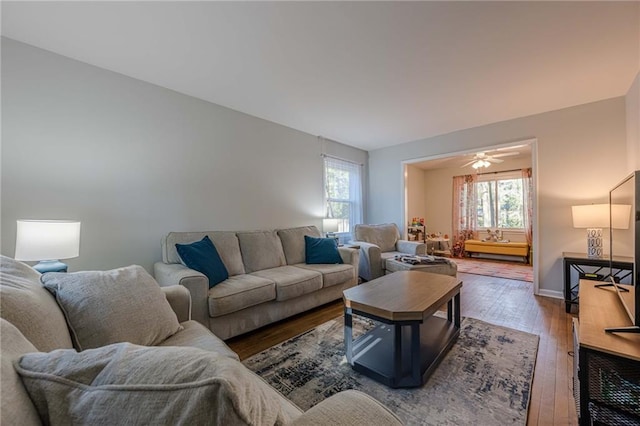 living room with baseboards and hardwood / wood-style flooring