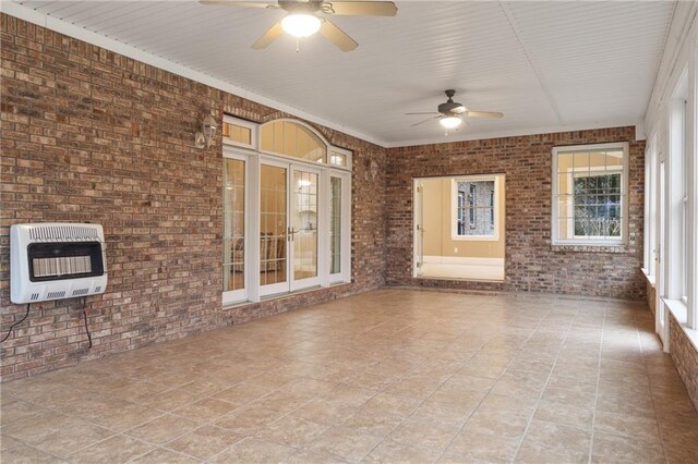 dining area with crown molding, plenty of natural light, hardwood / wood-style floors, and a chandelier