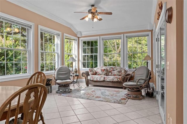 sunroom / solarium featuring lofted ceiling, a healthy amount of sunlight, and ceiling fan