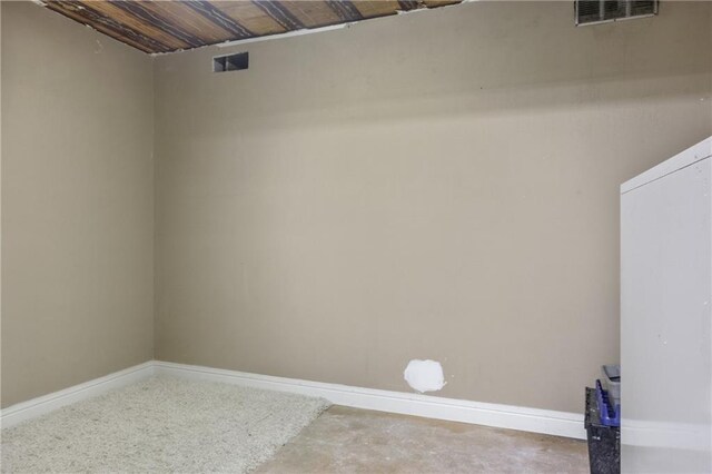 carpeted bedroom featuring ensuite bath and vaulted ceiling