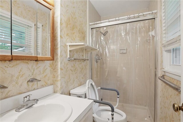 1960 Oak Leaf Ct SW, Marietta, GA 30008 - full bathroom featuring a stall shower, wallpapered walls, toilet, and vanity